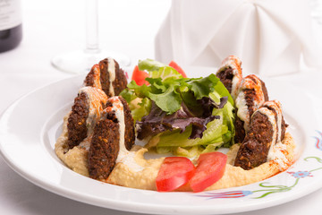 Falafel Appetizer Plate Garnished with Lettuce and Tomatoe Slice