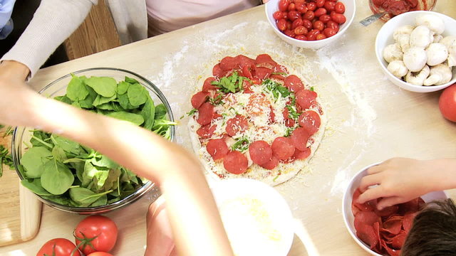 Healthy Caucasian Family Making Pizza Overhead Hands
