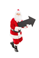 Smiling Santa Claus holding a big black arrow