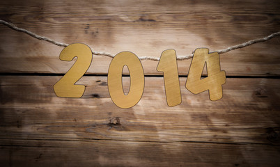 two thousand fourteen New Year number decoration hanging on rope