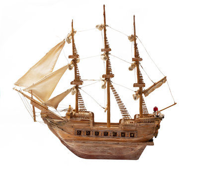 Antique ship as wooden model on white background.