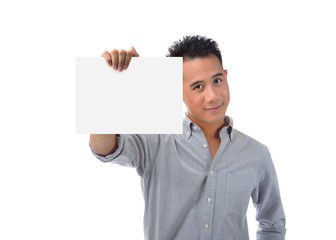 Young man holding blank billboard