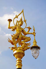 Fototapeta na wymiar A golden thai angel lighting pole, Thai style statue