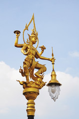 Fototapeta na wymiar A golden thai angel lighting pole, Thai style statue