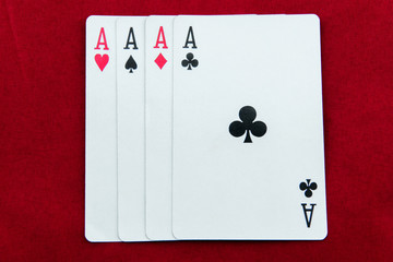 ACE-poker cards on red background