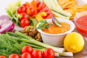 Vegetables, olives, nachos, red and cheese sause