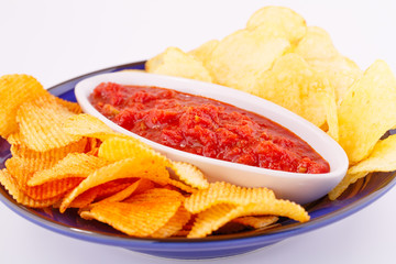 Potato chips and red sauce