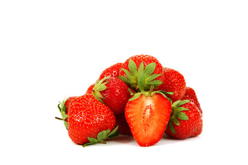Fresh strawberry fruit in a white dish with a wooden spoon.