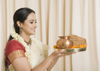 South Indian woman holding pooja thali
