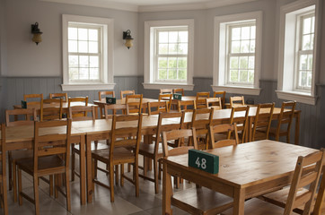 empty restaurant, brown wooden table and chairs in restaurant