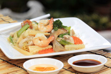 Chinese style stir fried yellow noodles with in gravy sauce