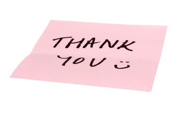 Text Thank You written on an adhesive note