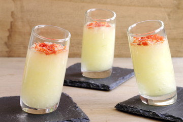 Shots of melon soup with crispy prosciutto