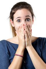 Young surprised woman holding her face