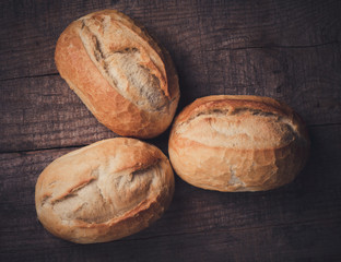 Wheat bread roll on a cutting board