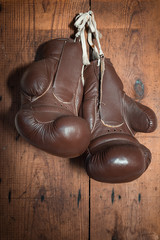 old Boxing Gloves, hanging on wooden wall