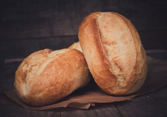 Wheat bread roll on a cutting board