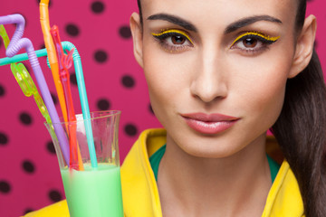 Colorful Closeup of beautiful model with cocktail