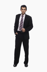 Portrait of a businessman standing with his hand in pocket