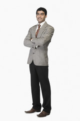 Portrait of a businessman standing with arms crossed