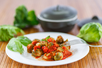 Brussels sprouts baked in tomato sauce