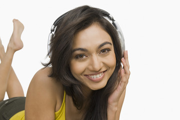 Fototapeta premium Portrait of a woman listening to headphones