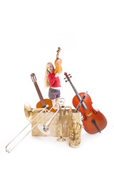 young girl with many musical instruments in box
