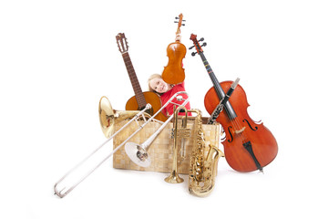 young girl with musical instruments in box