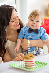 Obraz na płótnie Canvas Baby Boy And Mother With Birthday Cake On Table