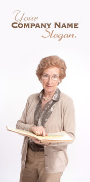 Senior lady pointing a page in a book