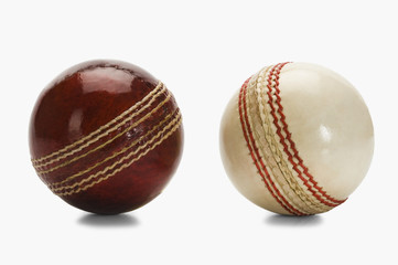 Close-up of two cricket balls