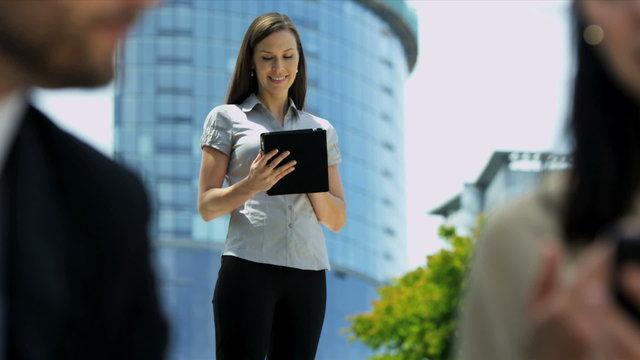Business person happy with results using wireless tablet hot spot 