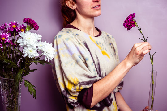Young woman arranging a bouquet of flowers