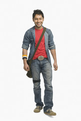 Fototapeta premium University student with a shoulder bag and smiling