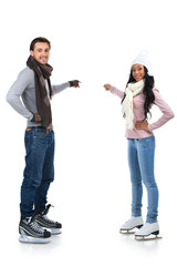 Smiling couple skatting together.