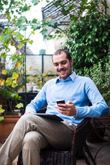 Fototapeta premium elegant business multitasking multimedia man at home