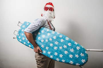 funny santa claus babbo natale ironing surfer