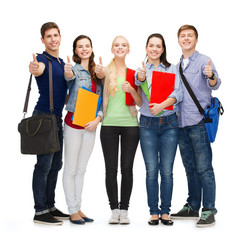 group of smiling students showing thumbs up