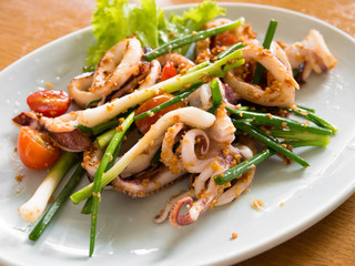 Stir fried squid with green onions