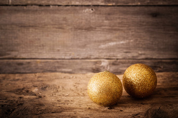 golden balls on wooden background