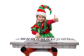 Girl Santa's elf plays a synthesizer