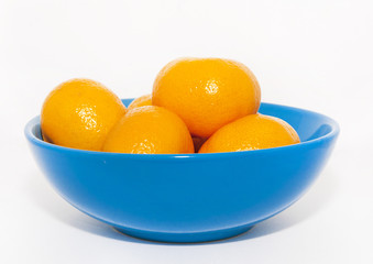 Mandarins in blue plate. Christmas and New Year tradition