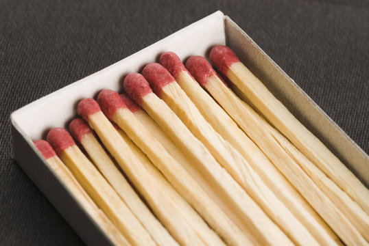 Close-up of an open matchbox with matchsticks