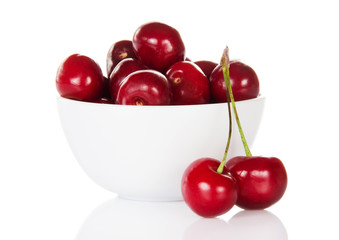Close-up fresh cherrys in white cup