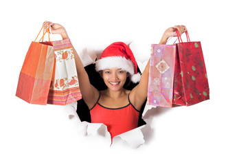 girl holding shopping bags in a hole