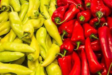 Fresh harvest of green and red peppers  in local fruit market