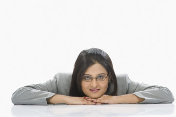 Fototapeta premium Portrait of a businesswoman leaning on a table