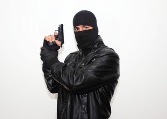 Masked hitman with the hand gun