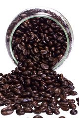 Coffee beans spilling out from a jar