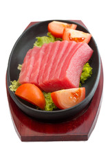 fresh raw tuna fish pieces on plate isolated